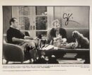Actors sitting with a dog