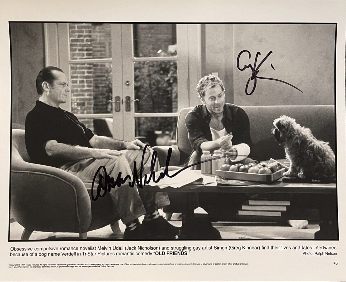 Actors sitting with a dog