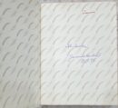 Open book with handwritten notes inside cover.
