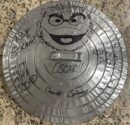 Metal lid with Oscar the Grouch drawing.