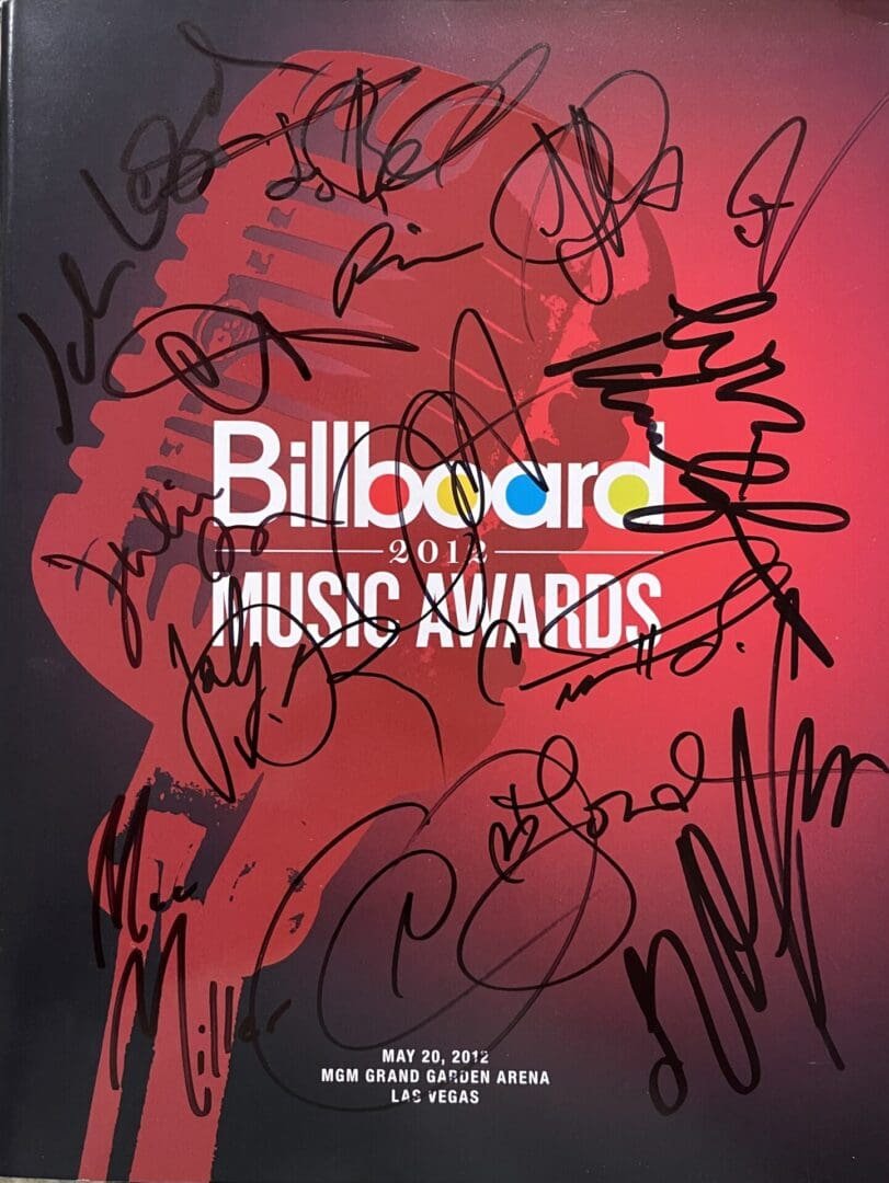 Billboard Music Awards 2012 program with signatures.