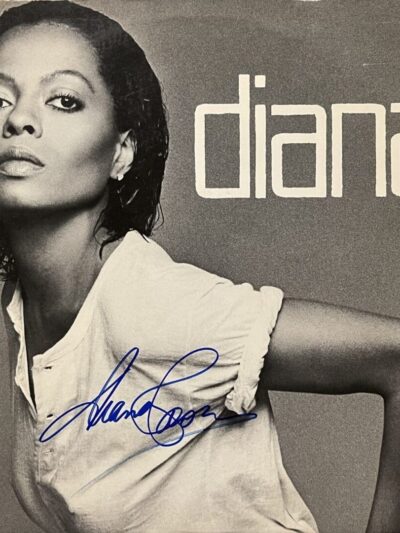 Black and white album cover with signature.
