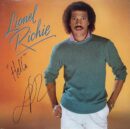 Singer posing on "Hello" album cover.