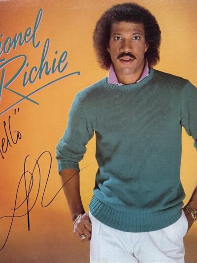 Singer posing on "Hello" album cover.