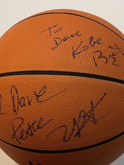 Autographed basketball with handwritten messages.