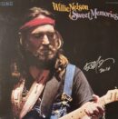 Musician playing guitar on album cover.