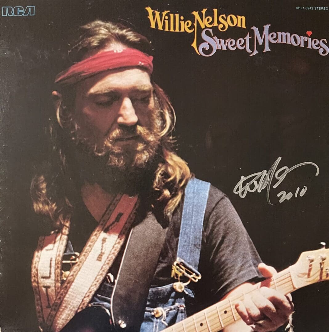 Musician playing guitar on album cover.