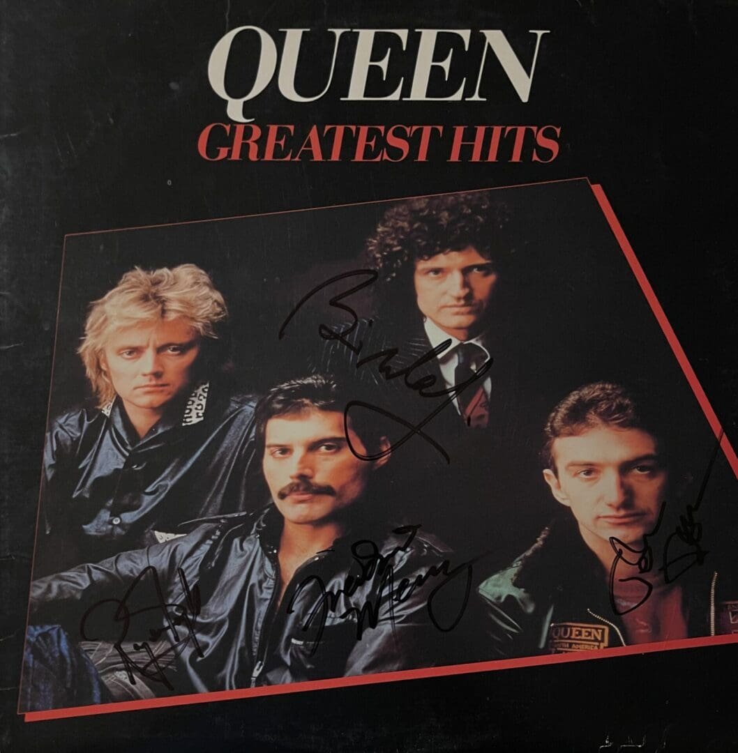 Queen Greatest Hits album cover with signatures.