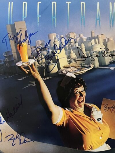 Smiling waitress holding tray and menu.