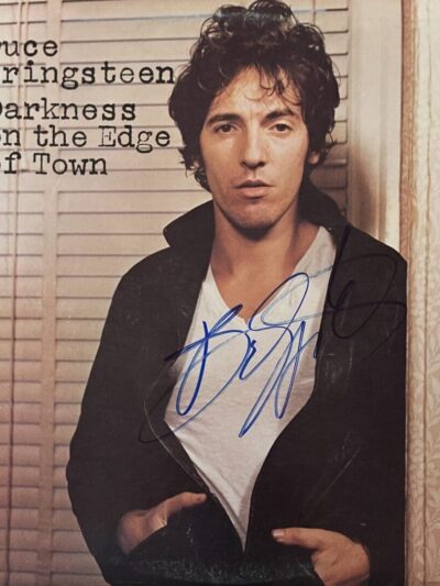 Album cover with man's autograph and signature.