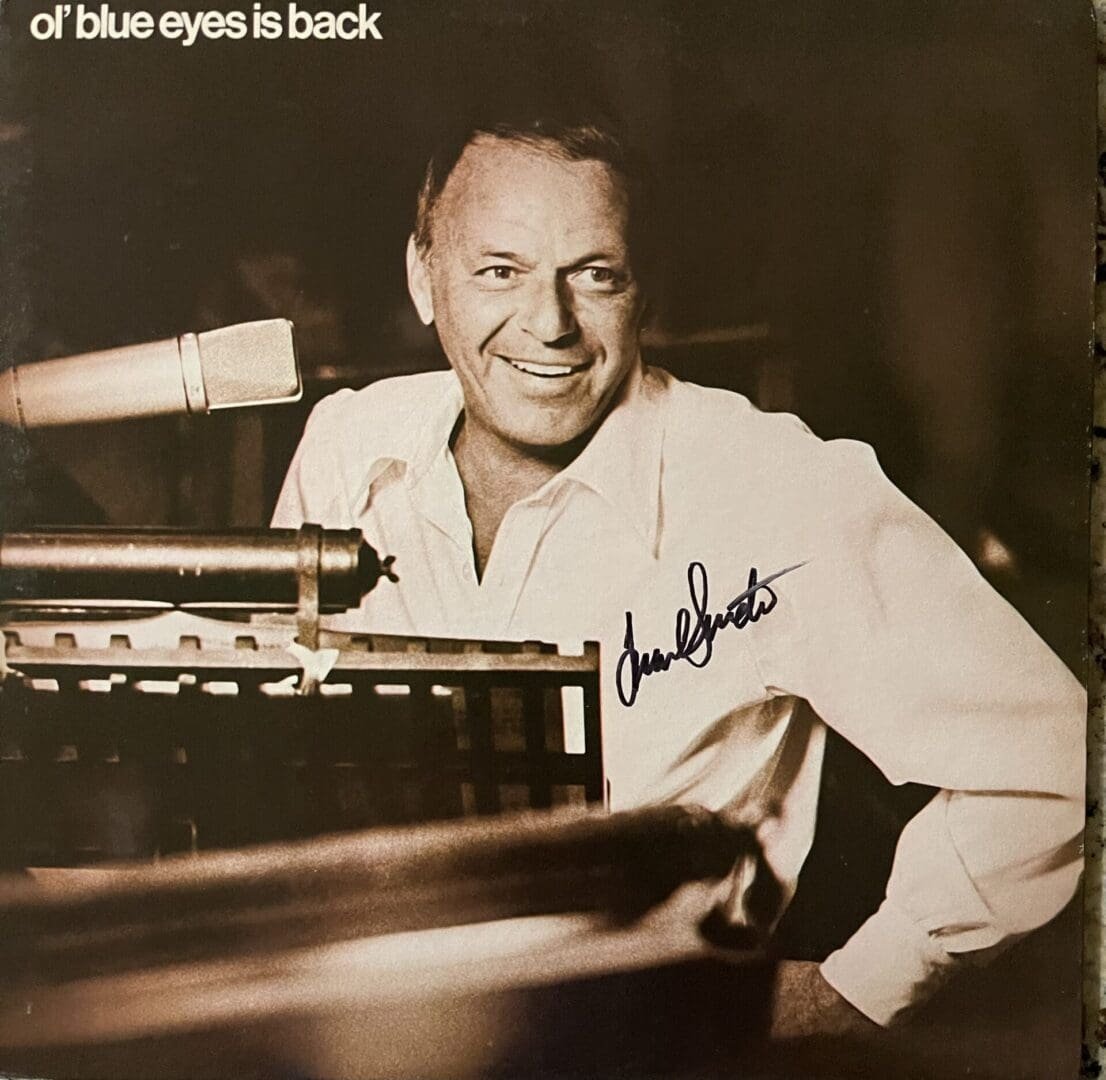 Man smiling beside microphone