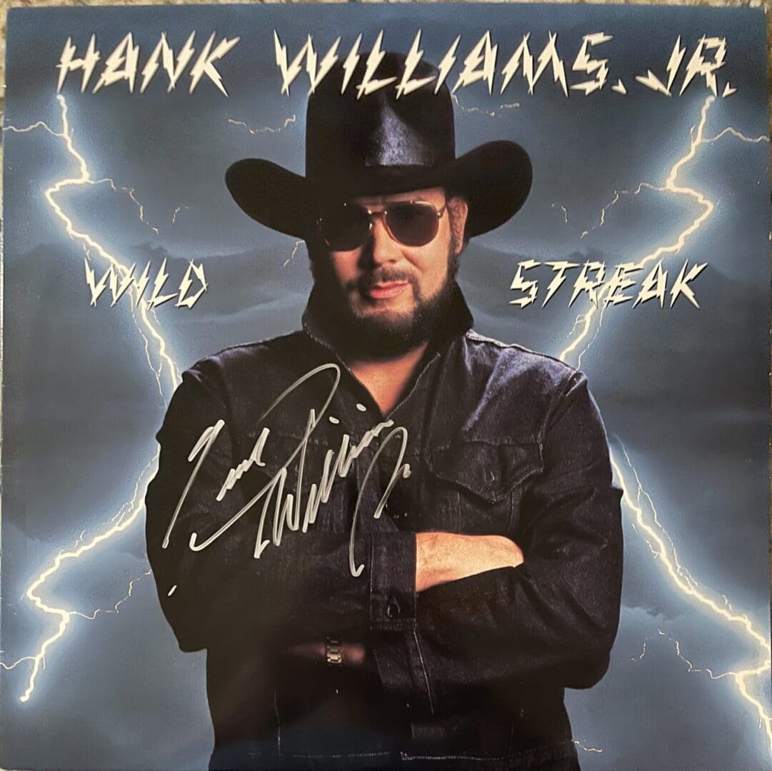 Man in black hat with lightning background.