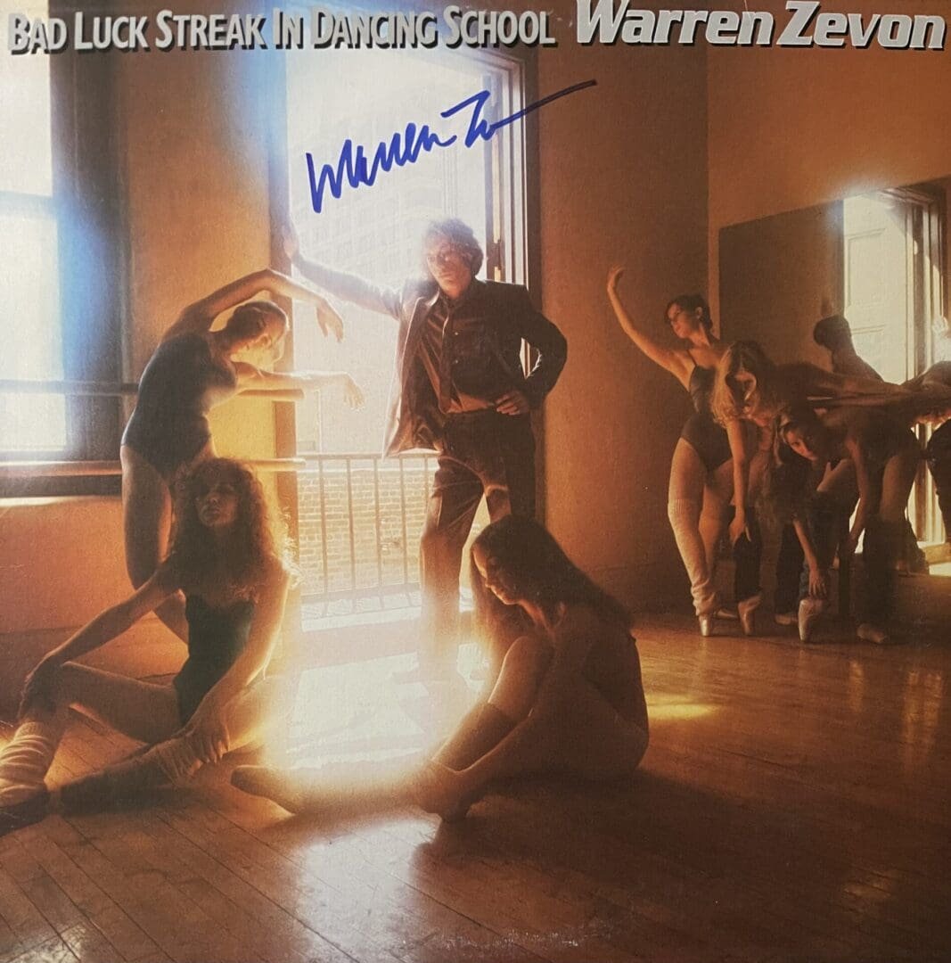 Dancers posing in a ballet studio.