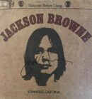 Album cover with stylized portrait and signature.