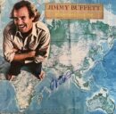 Smiling man on a world map background.