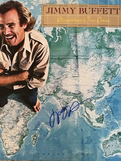 Smiling man on a world map background.