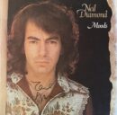 Album cover with man's portrait and signature.