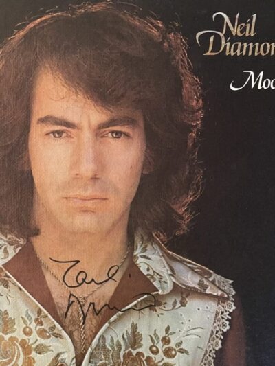Album cover with man's portrait and signature.