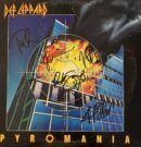 Def Leppard's Pyromania album cover with signatures.