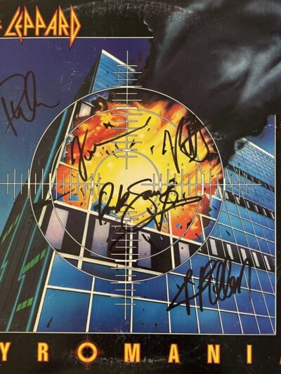 Def Leppard's Pyromania album cover with signatures.