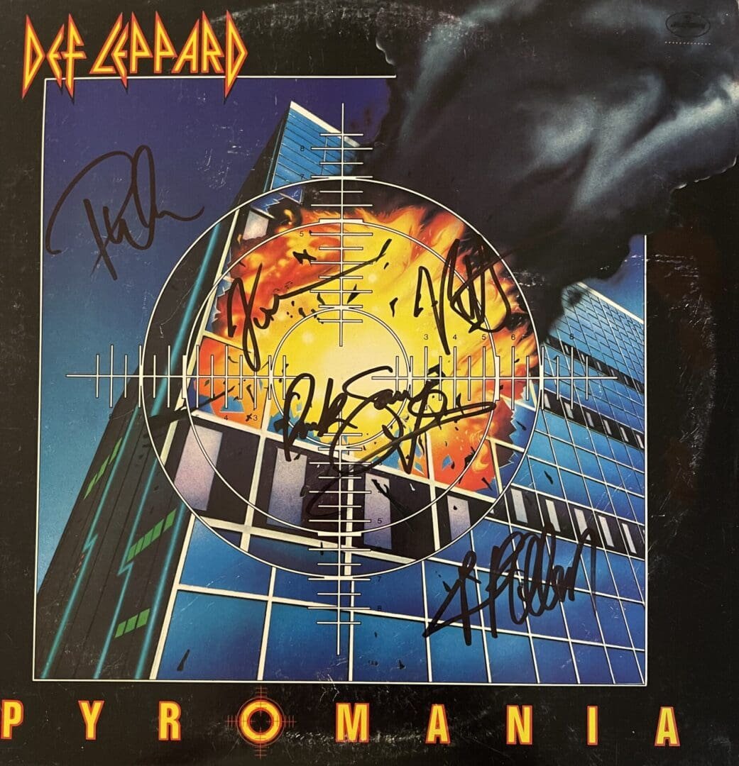Def Leppard's Pyromania album cover with signatures.