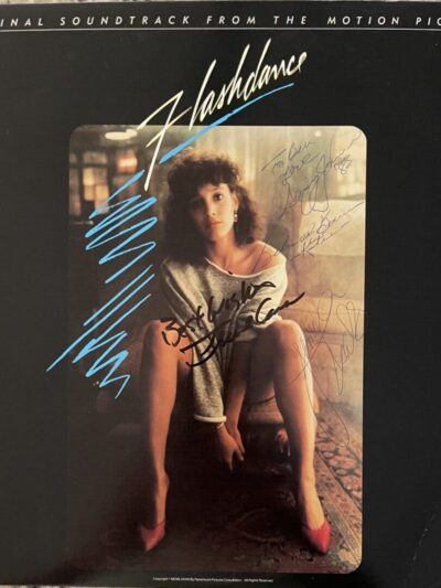 Flashdance soundtrack cover with seated woman.