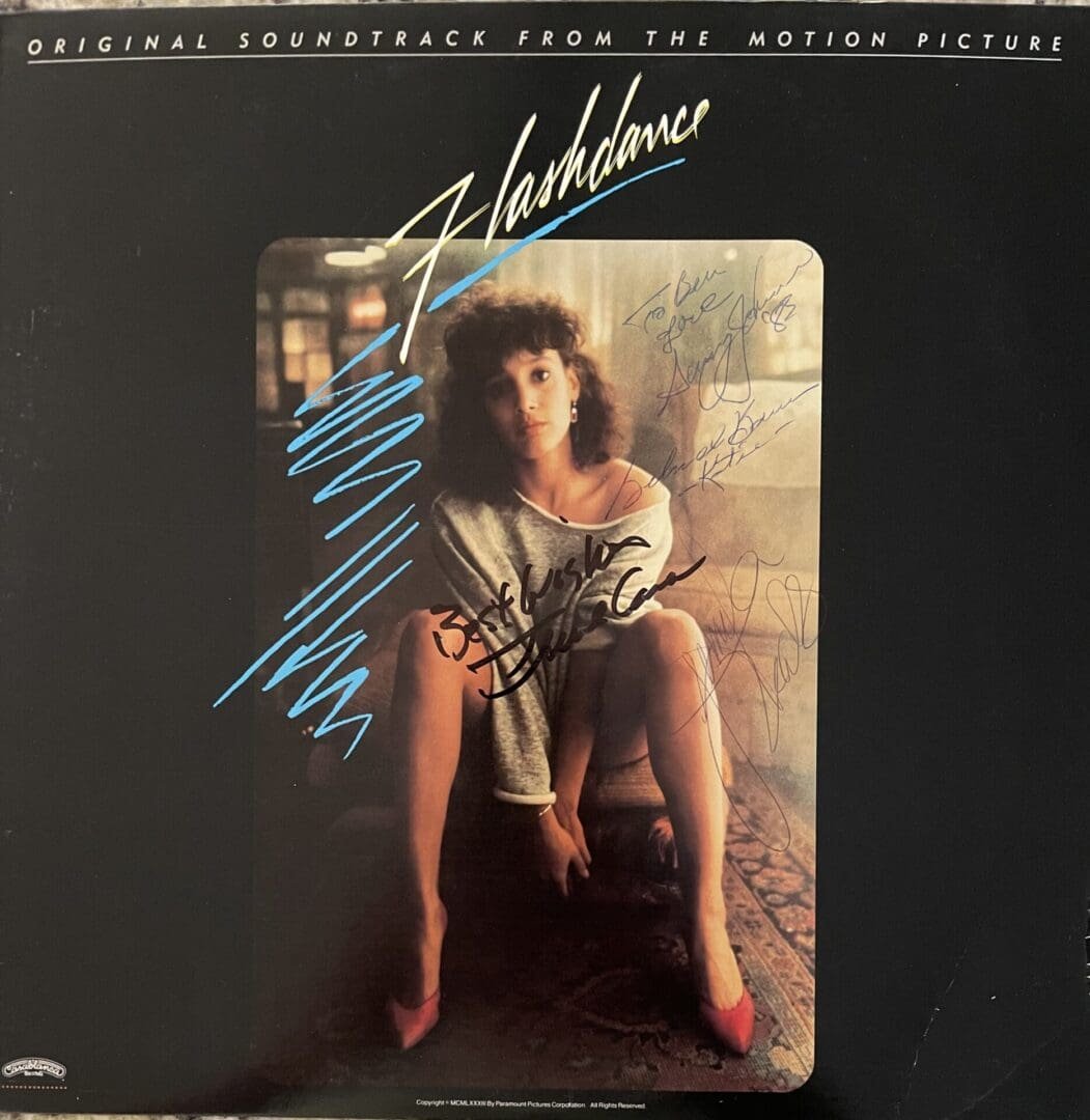Flashdance soundtrack cover with seated woman.