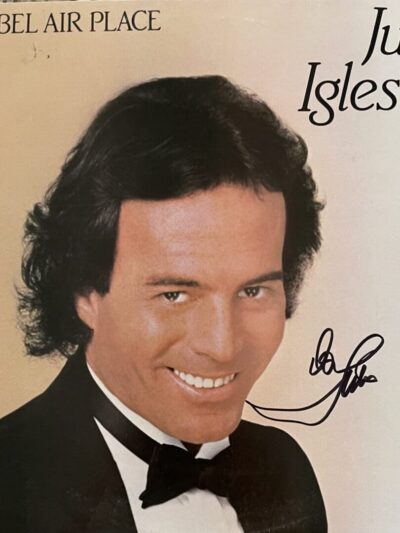 Album cover with smiling man in tuxedo.