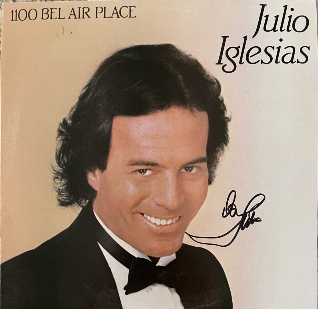 Album cover with smiling man in tuxedo.