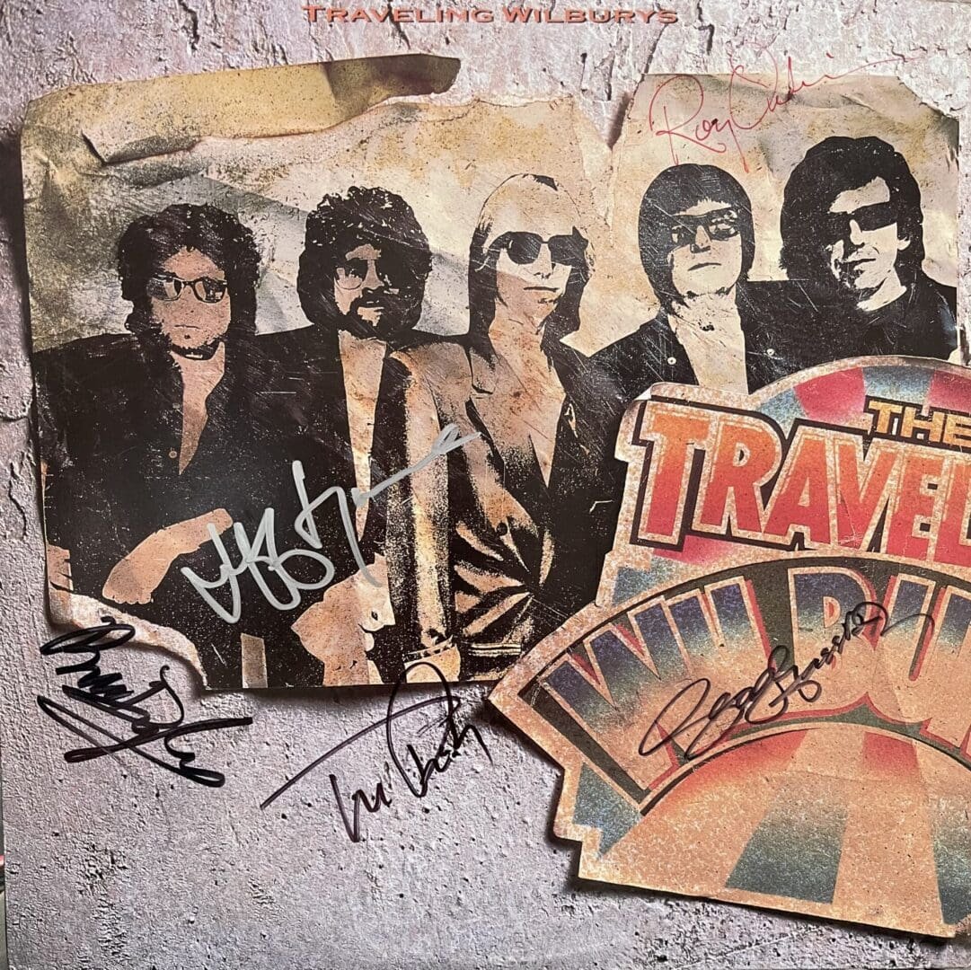 Traveling Wilburys album cover with signatures.