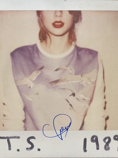 Polaroid photo with printed signature T.S.