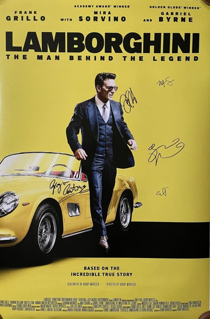 Man in suit beside yellow Lamborghini car.