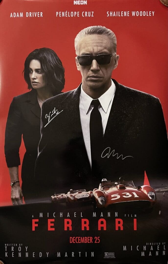 Movie poster featuring three actors and cars.