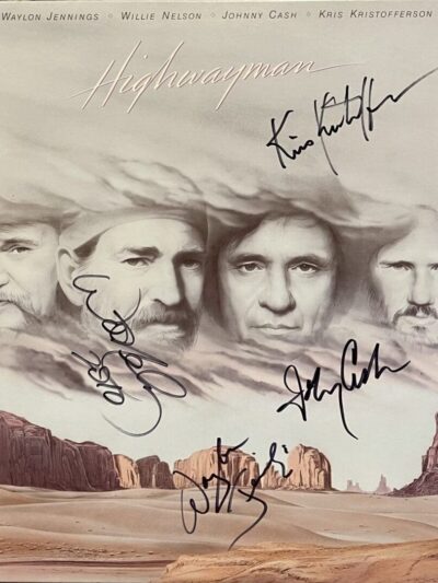 Four faces with signatures over desert landscape.