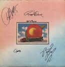 Album cover with a peach and signatures.