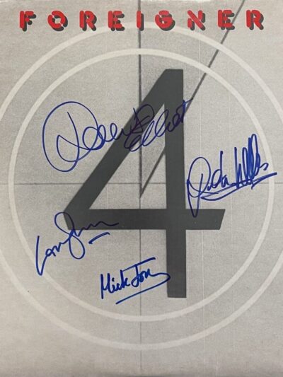 Album cover with autographs and number four.