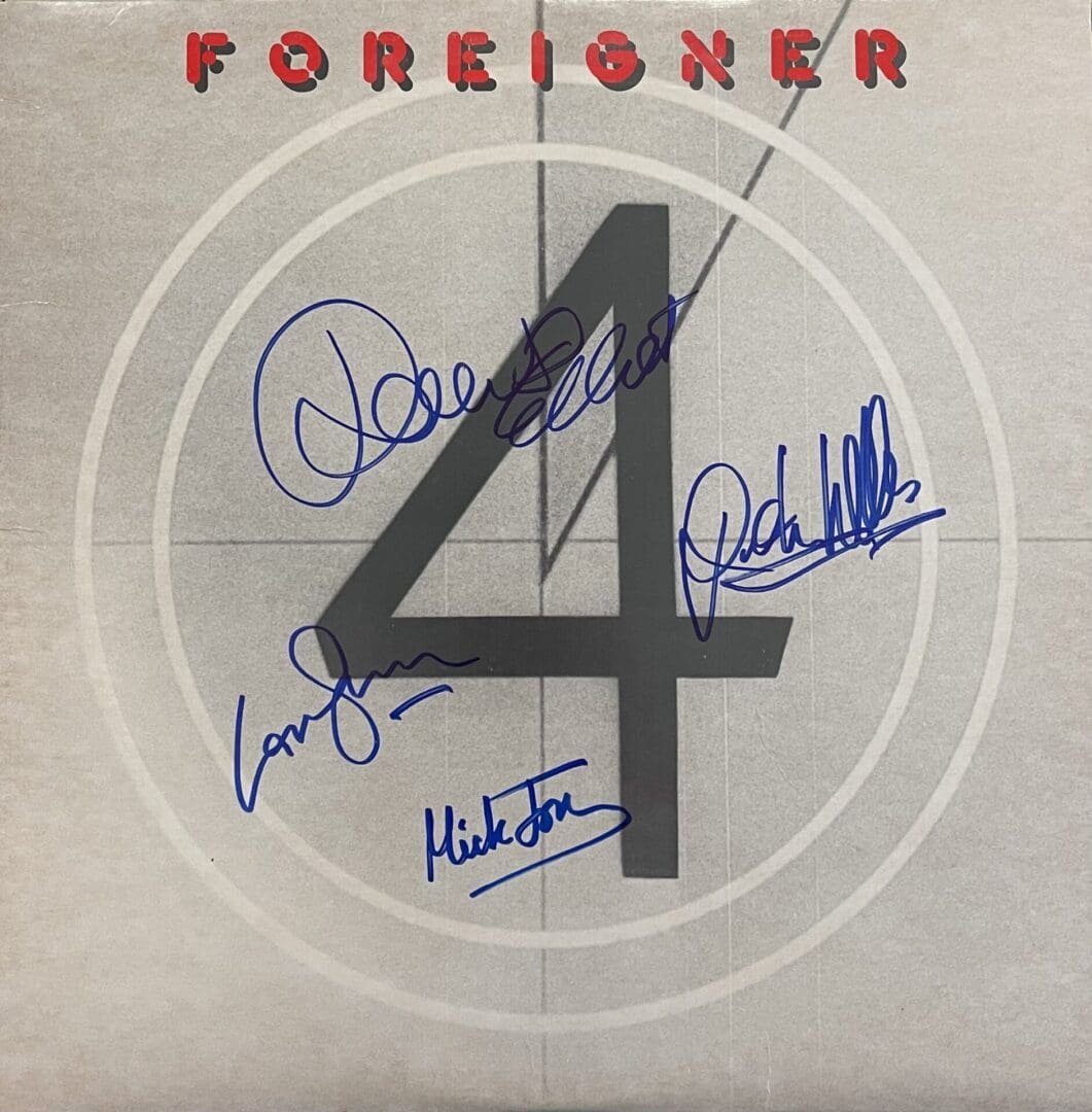 Album cover with autographs and number four.