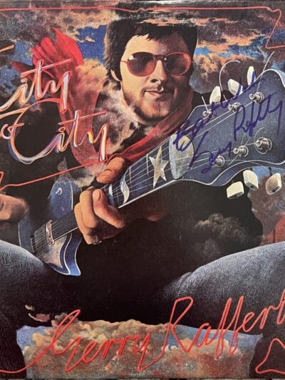 Man with guitar on colorful album cover.