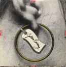 Golden earring with tag illustration.
