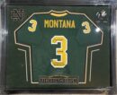 Framed green football jersey with signatures.