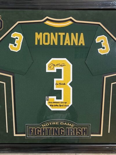 Framed green football jersey with signatures.