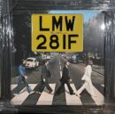 Album cover with street crossing and sign.