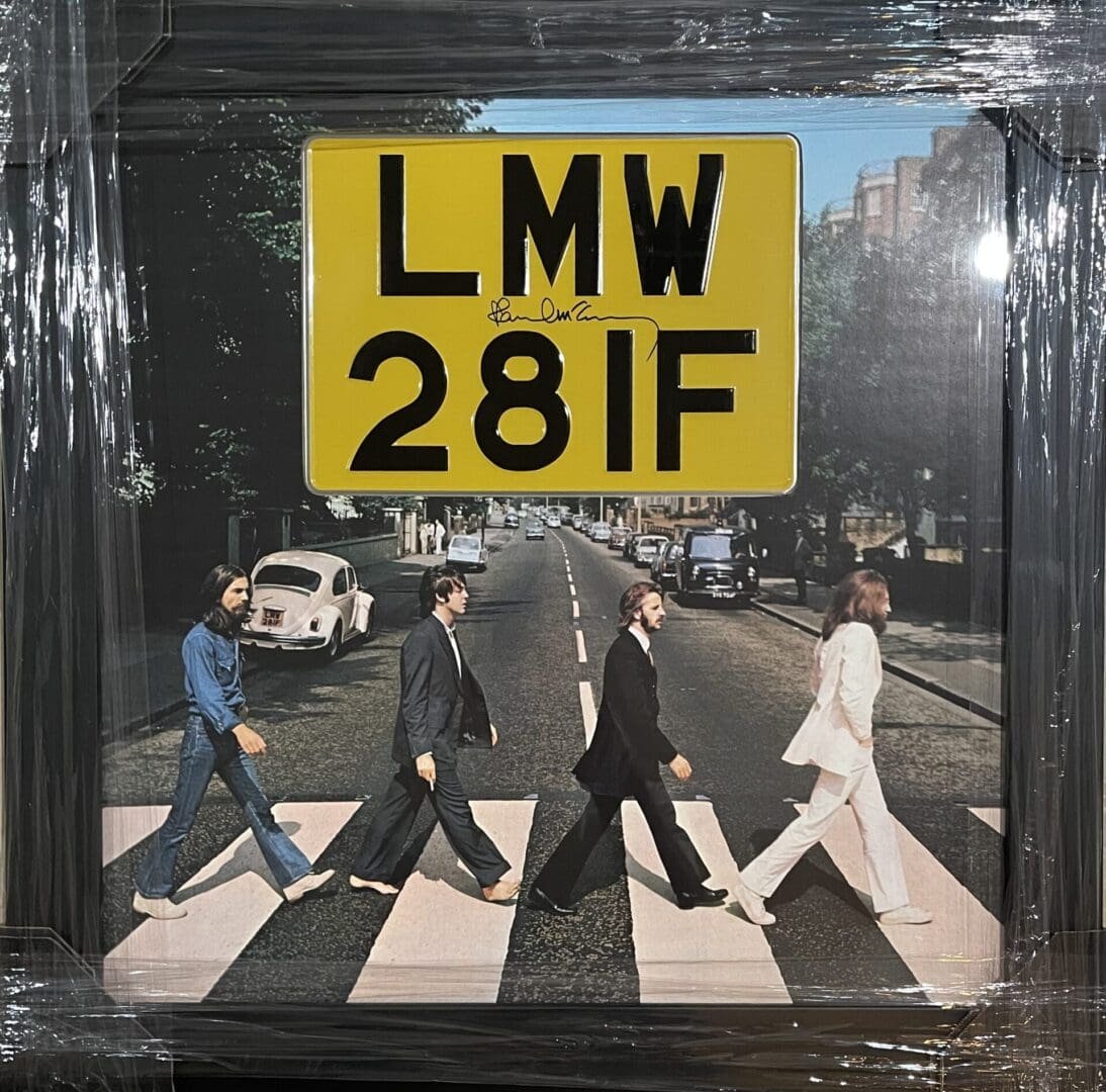Album cover with street crossing and sign.