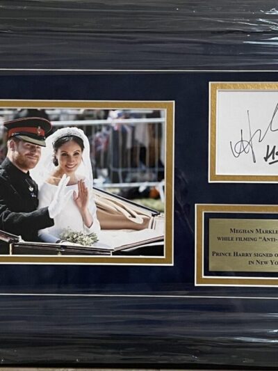 Framed wedding photo with autographs and plaque.