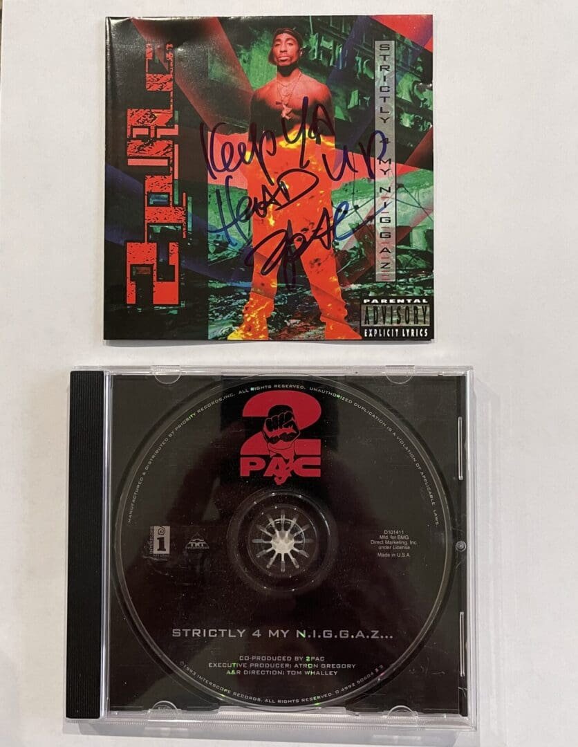 Autographed album cover and CD.