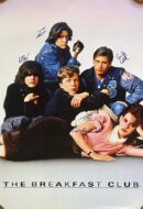 Group of five teenagers sitting together.