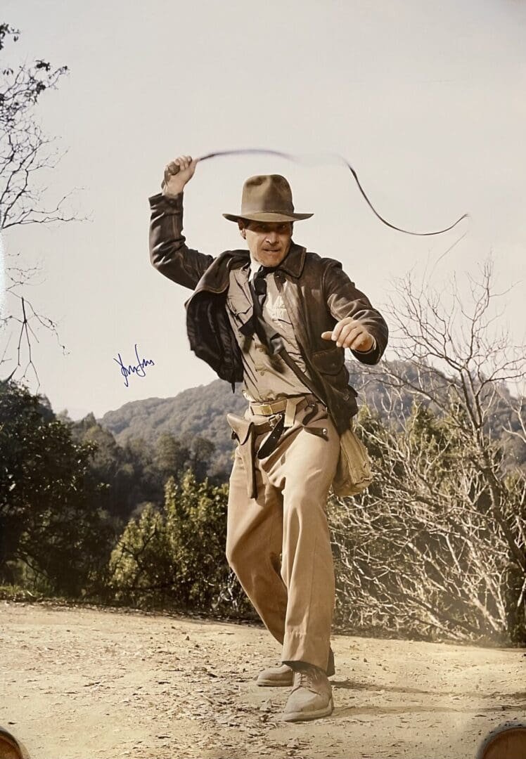 Adventurer with whip in outdoor setting.