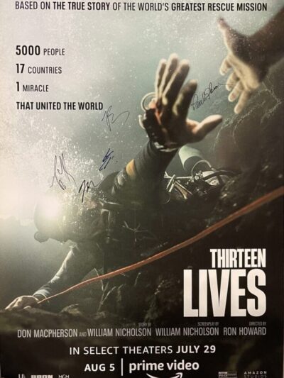 Divers underwater in "Thirteen Lives" movie poster.