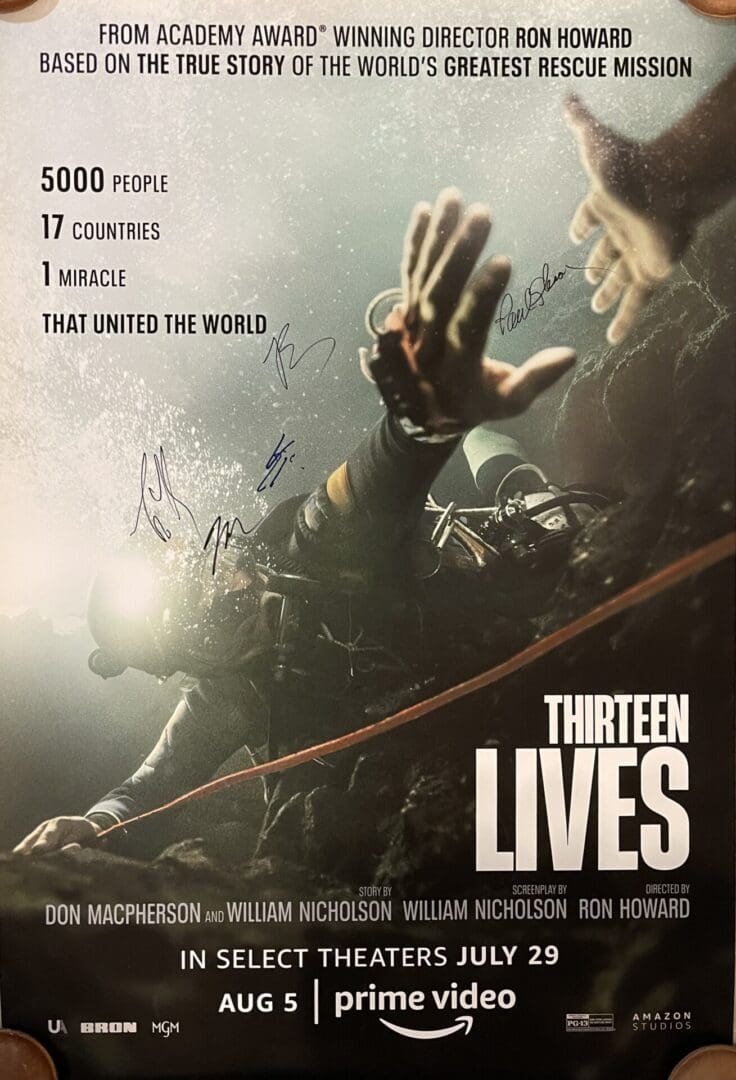 Divers underwater in "Thirteen Lives" movie poster.