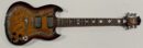 Electric guitar with ornate design and signatures.